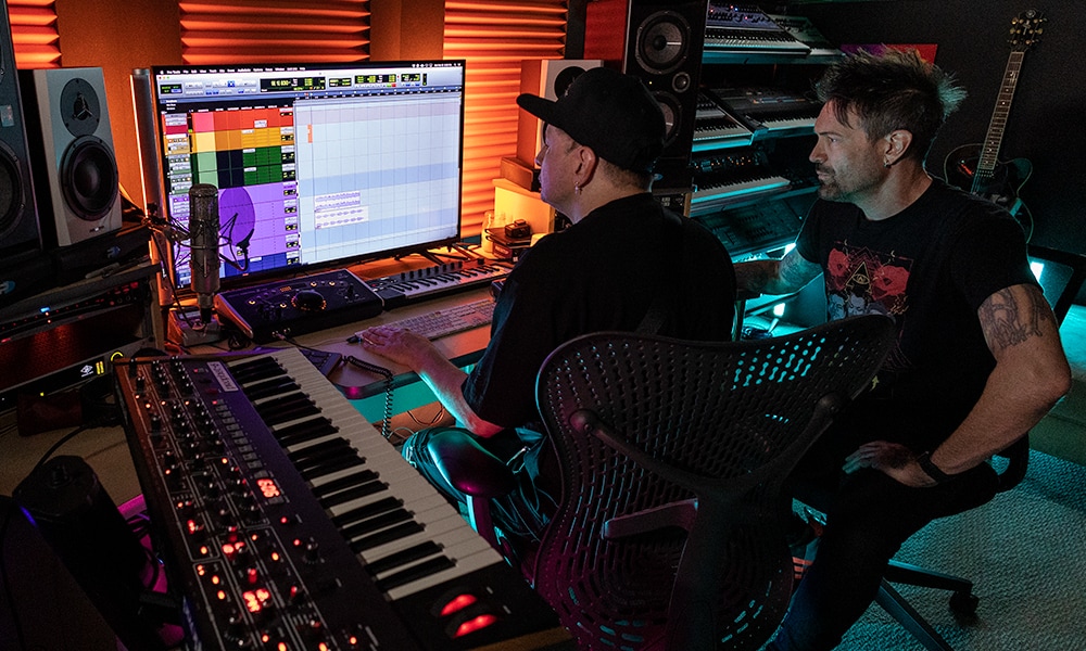 Two men working on a music track using Pro Tools