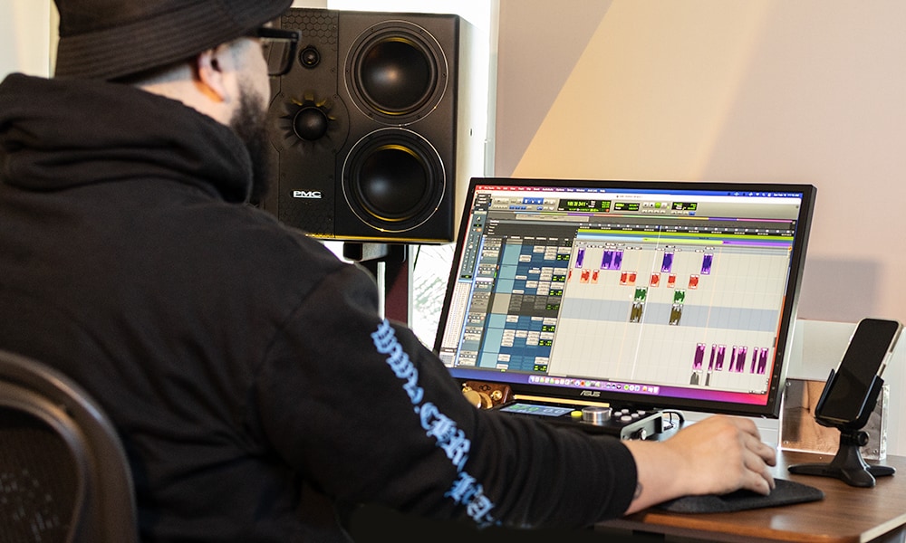 Photo from behind showing Pro Tools user working with the software