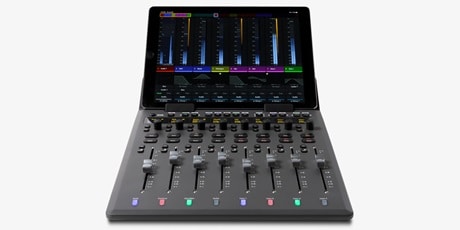 Front shot of Avid Dock with knobs and faders connected to tablet showing Avid Control