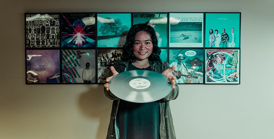 mastering engineer Jett Galindo shows off her vinyl